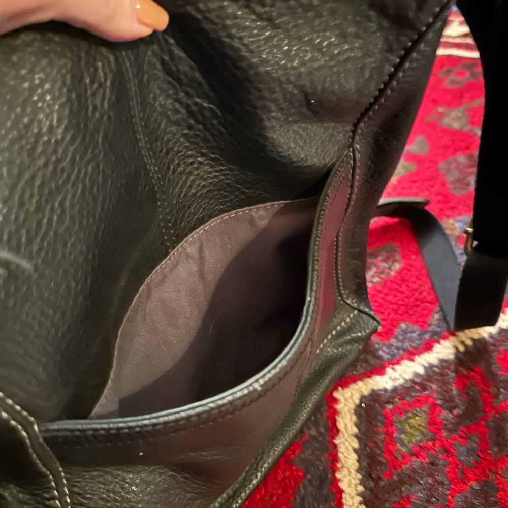 The Sak - black leather crossbody purse.